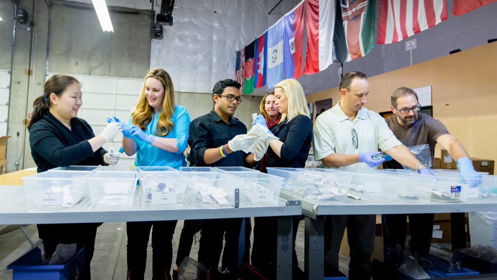 Microsoft’s “loaned professionals” work to sort medical supplies that will be shipped to overseas hospitals and clinics that need them. (Photo by Scott Eklund/Red Box Pictures)
