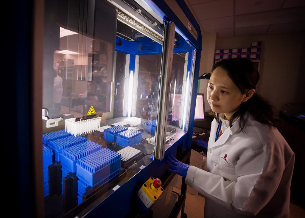 A scientist works in a genomic sequencing lab at St. Jude Children’s Research Hospital