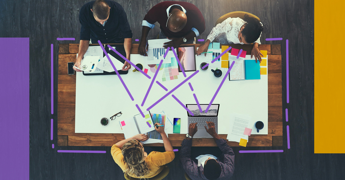 Five people working at a table