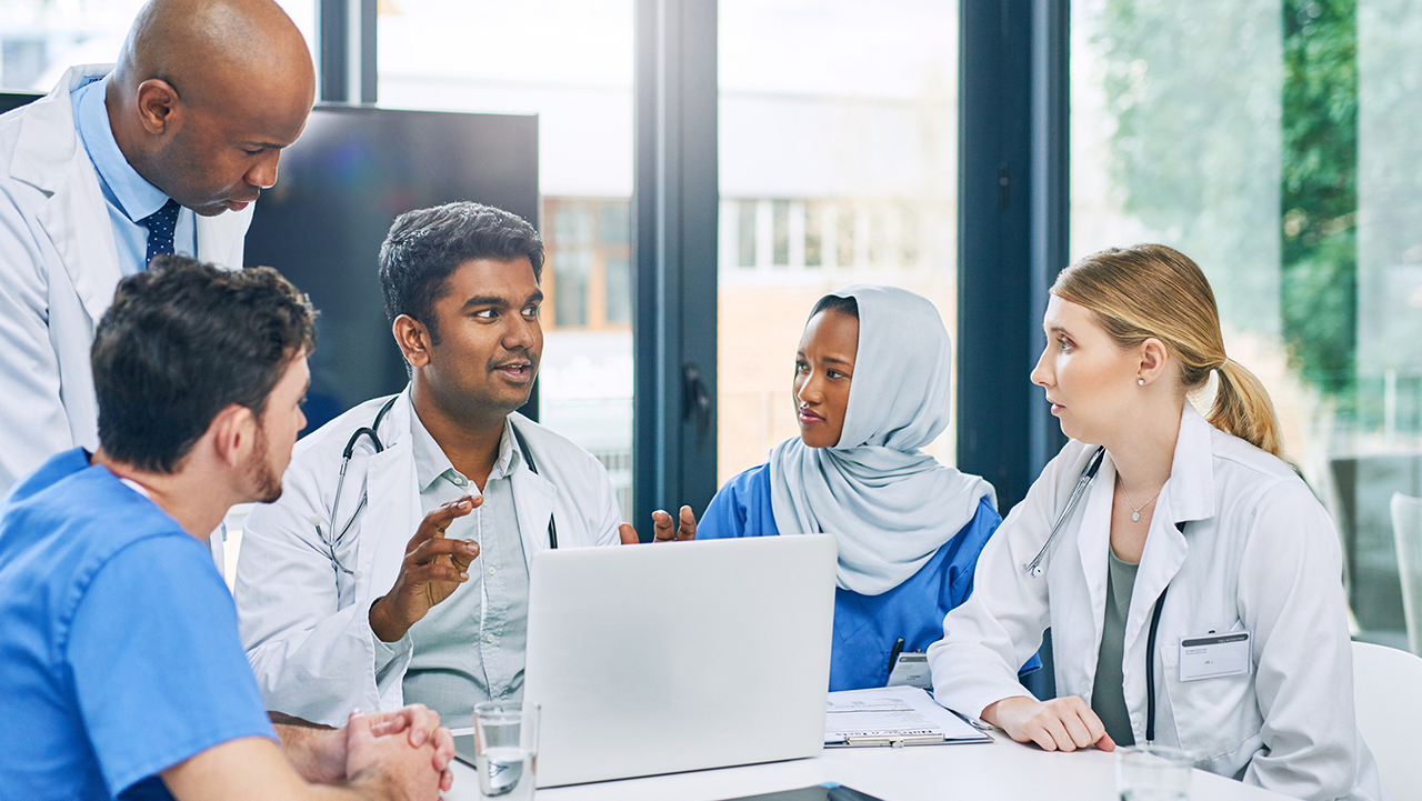 Five health care clinicians talking
