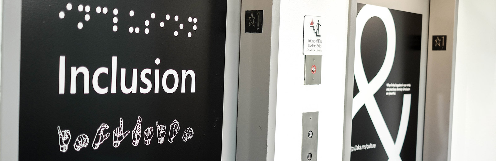 Inclusion sign near elevator