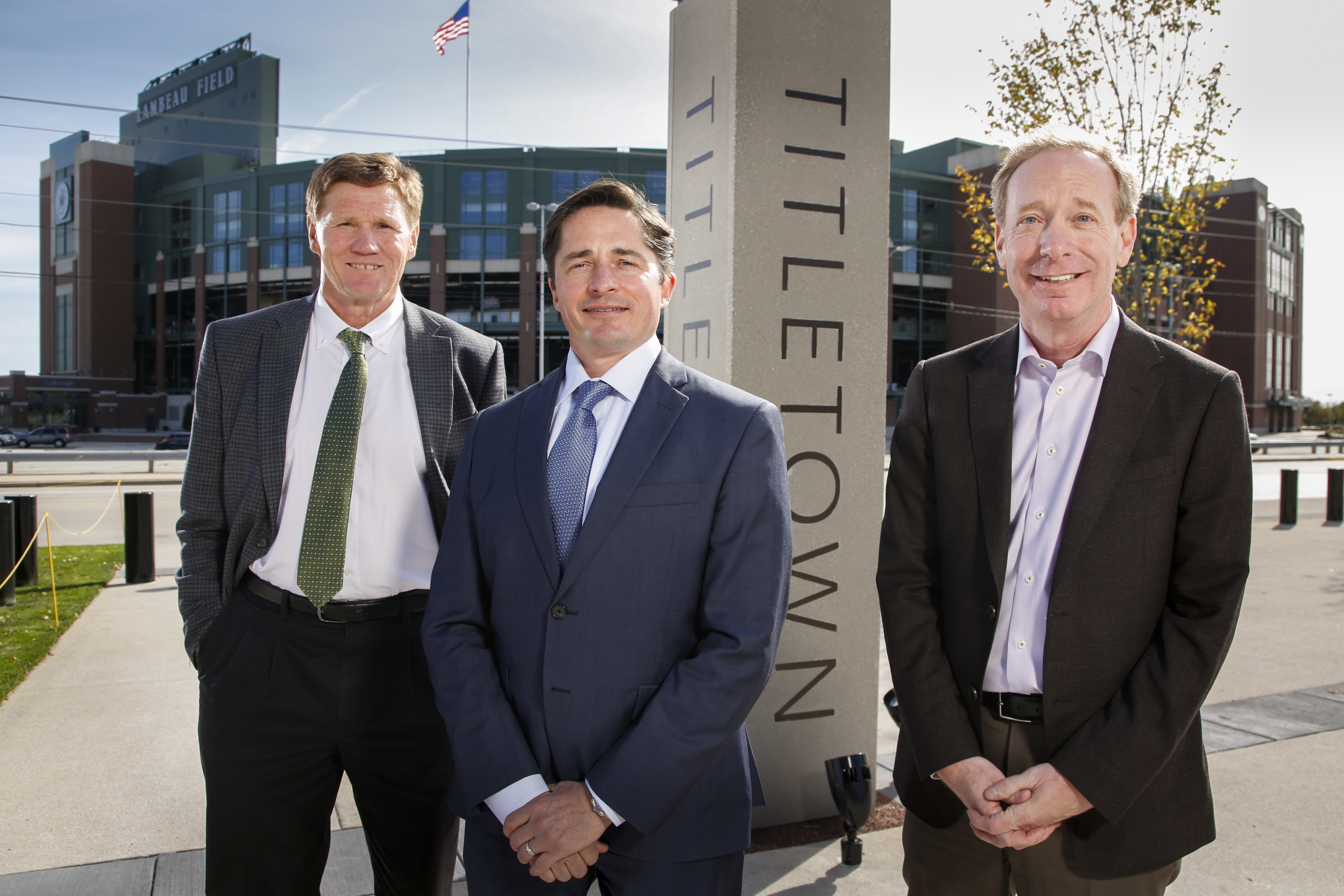 Mark Murphy, president & CEO, Green Bay Packers; Ed Policy, vice president & general counsel, Green Bay Packers; and Brad Smith, president, Microsoft, [pictured left-to-right] in Green Bay’s Titletown District, adjacent Lambeau Field, to announce TitletownTech