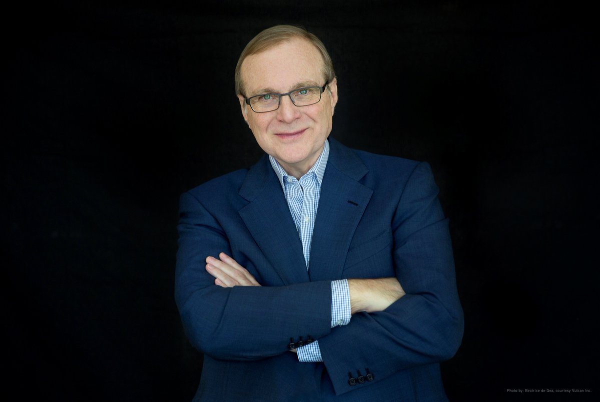 Recent photo of Paul Allen smiling, his arms folded