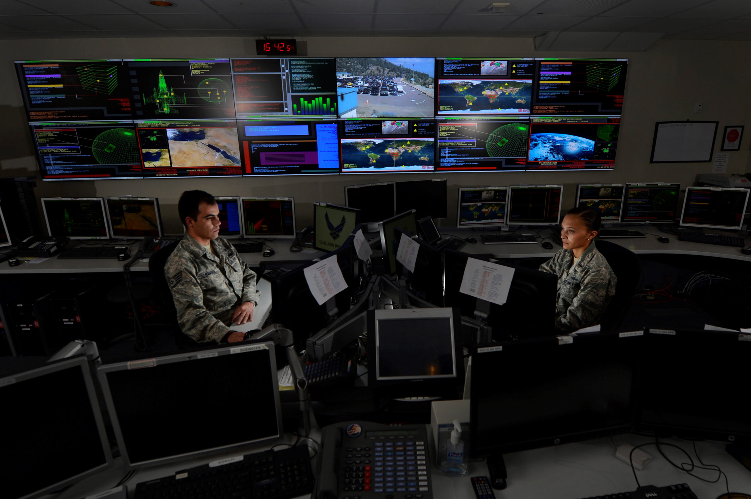 Two U.S. Air Force personnel in a computer room