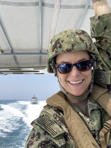 Female soldier on boat