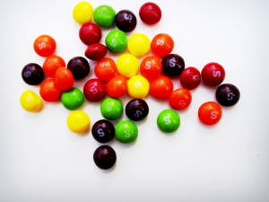 Rainbow Skittles on a white background