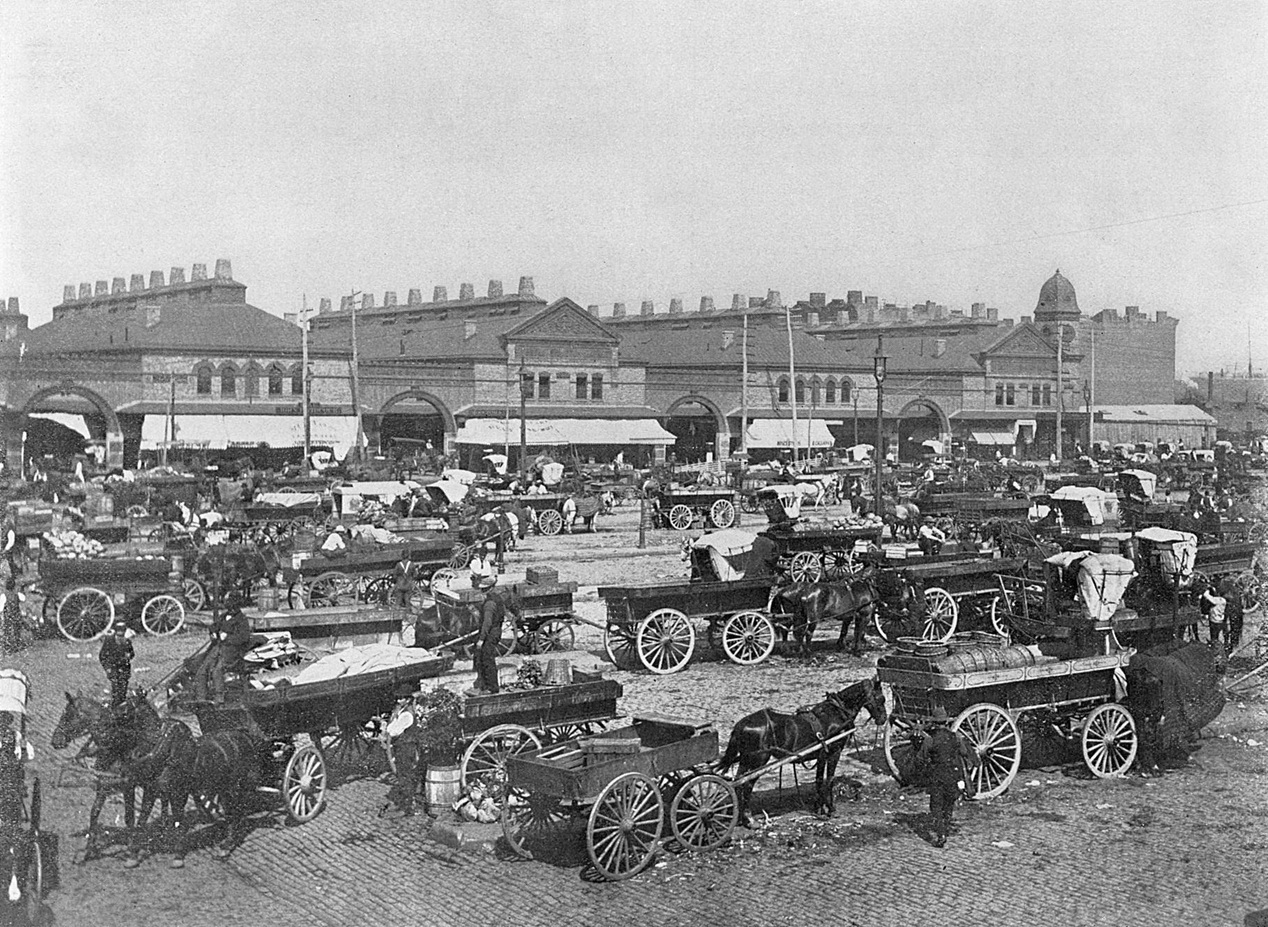 West Washington Market, New York City, USA, with horses, carts and traders.