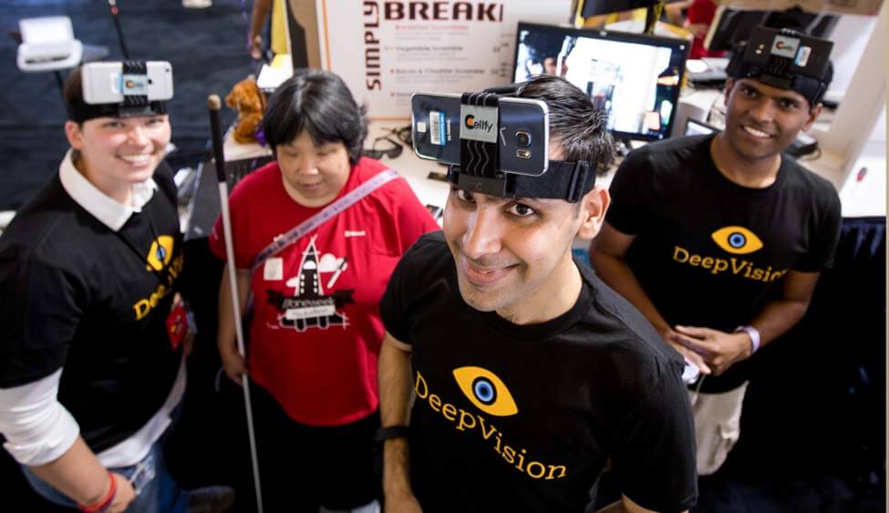 Photo of Deep Vision Team Together Wearing Head-mounted Cameras