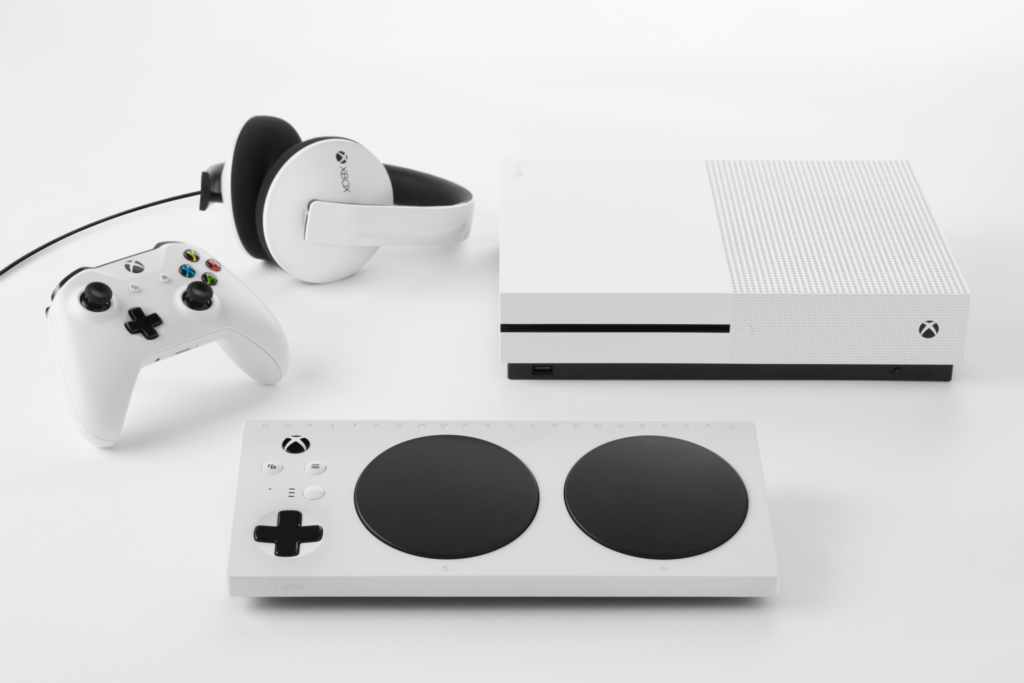 The Xbox Adaptive Controller with the Xbox, Xbox headphones and an Xbox controller.