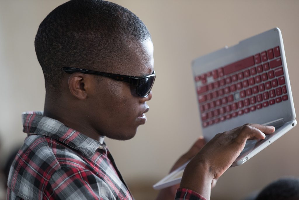 A man holding a computer