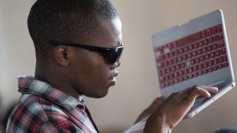 A man holding a computer