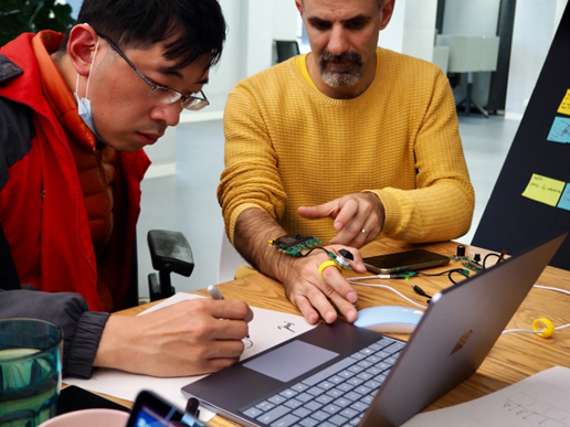 two men working an assistive technology prototype using Jacdac and micro.bit 