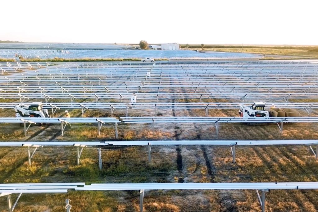 Autonomous vehicles follow workers in a solar farm