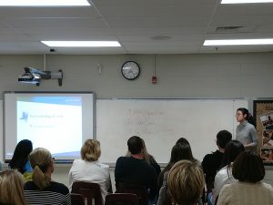 Student talks to parents attending class about online safety