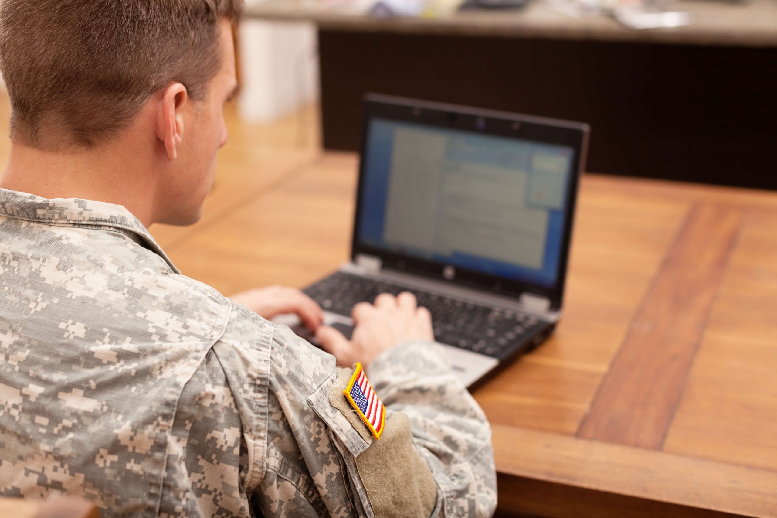 American soldier with a laptop