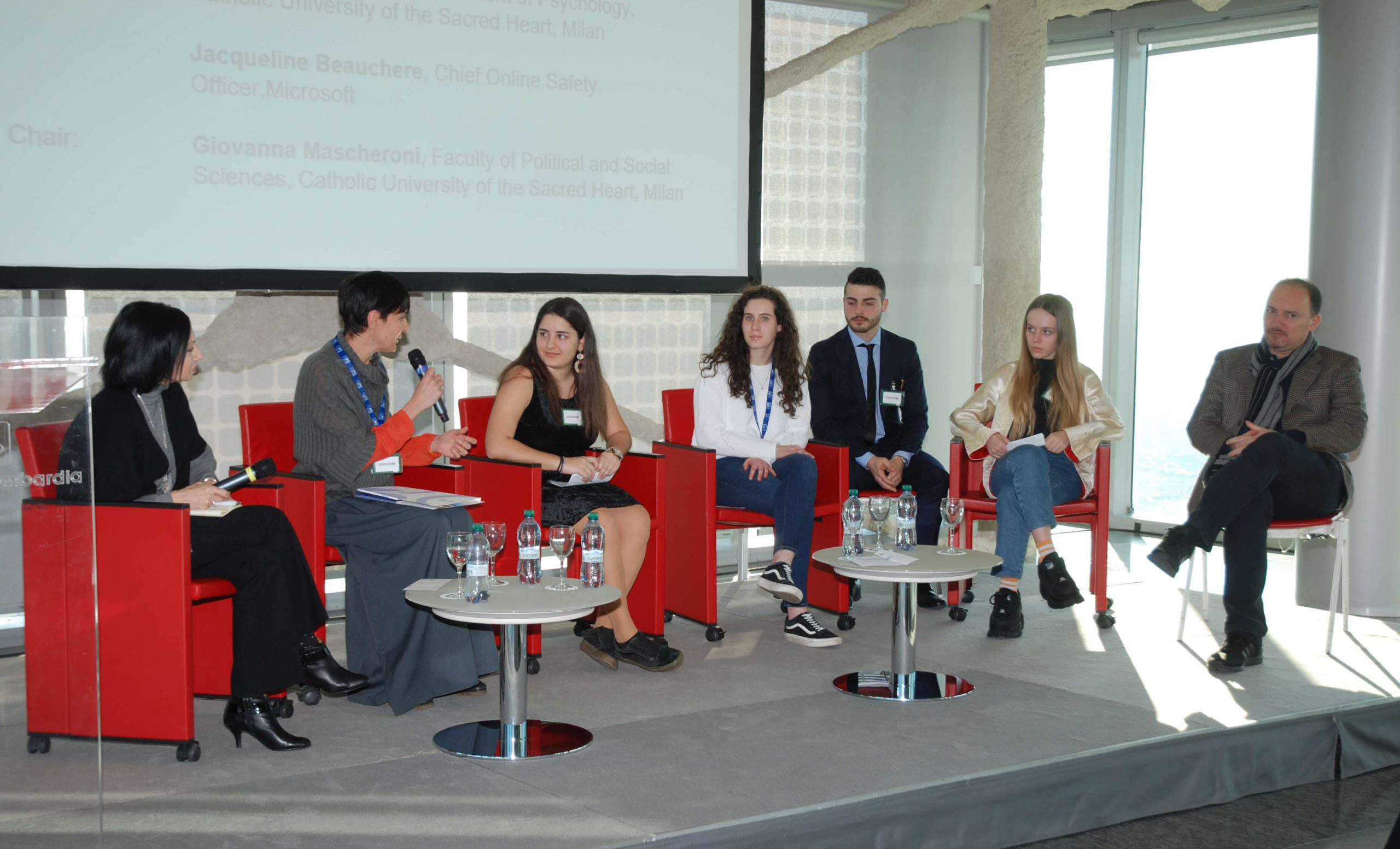 Jacqueline Beauchere participates in a panel discussion on online well-being with teens and researchers in Milan, Italy.