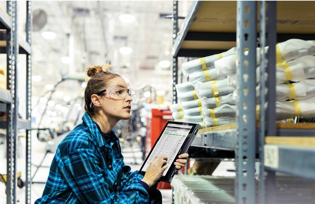 Woman with a tablet computer in a warehouse