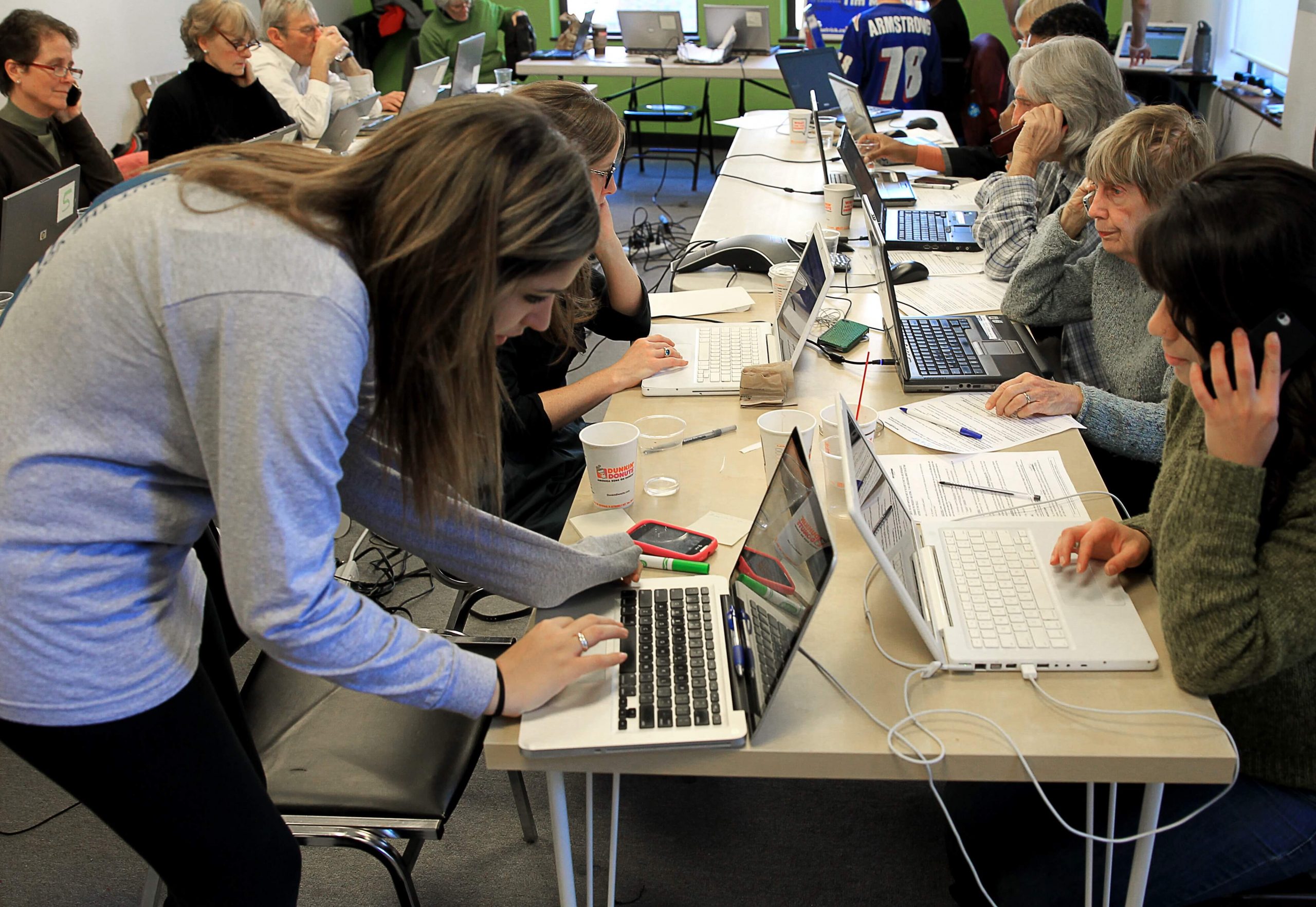 campaign staff working on laptops in a room