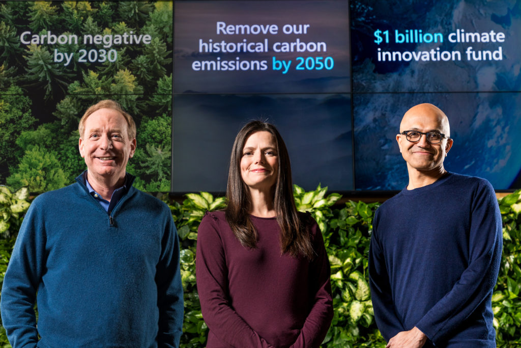 Brad Smith, Amy Hood and Satya Nadella preparing for a sustainability announcement