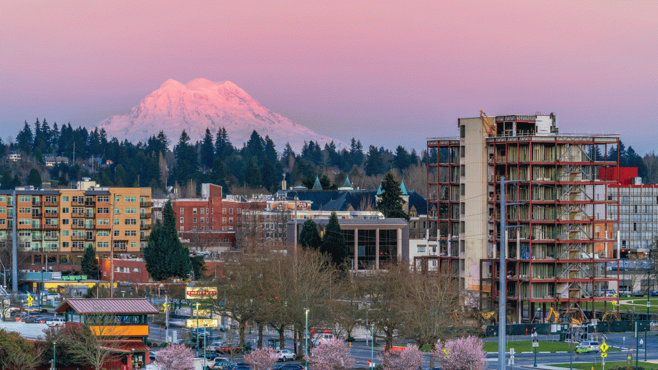 A group of apartments with Mount Rainier in the background