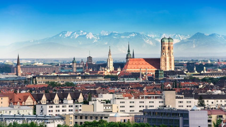 the Munich skyline with mountains in the background
