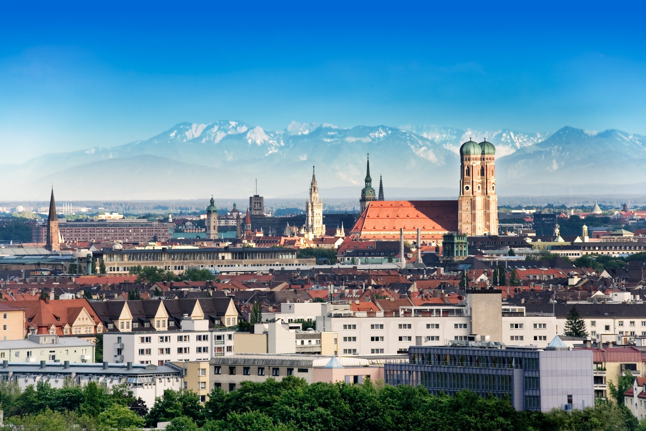 the Munich skyline with mountains in the background
