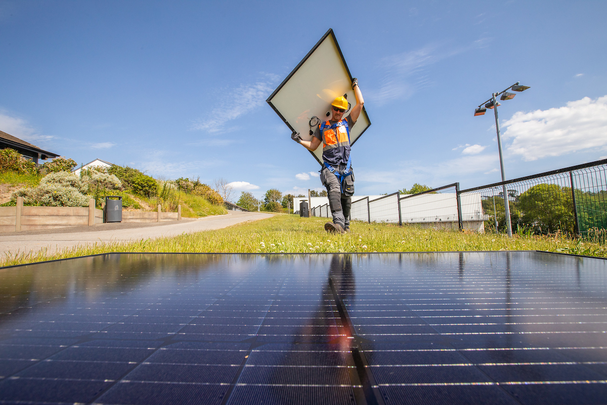 Ryan Doran works on a solar panel installation at Kinsale Community School, Cork, Ireland as part of a renewable energy project with Microsoft and SSE Airtricity. Naoise Culhane Photography