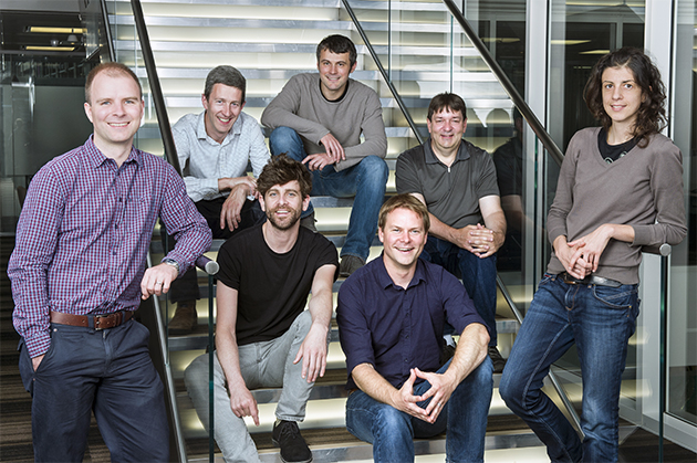 The team working on hand track in Microsoft's UK lab includes Tom Cashman (top left, standing), Andrew Fitzgibbon, Lucas Bordeaux, John Bronskill, (bottom row) David Sweeney, Jamie Shotton, Federica Bogo. Photo by Jonathan Banks.