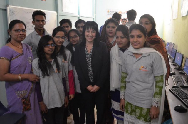 Lori Harnick, center, on a visit to a community learning center in India where Microsoft is funding IT skills for young women to help them harness their economic development. 